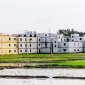 বড়পুকুরিয়া কয়লা খনি সম্প্রসারণের আগে কৃষিজমিতে বহুতল ভবন নির্মাণ